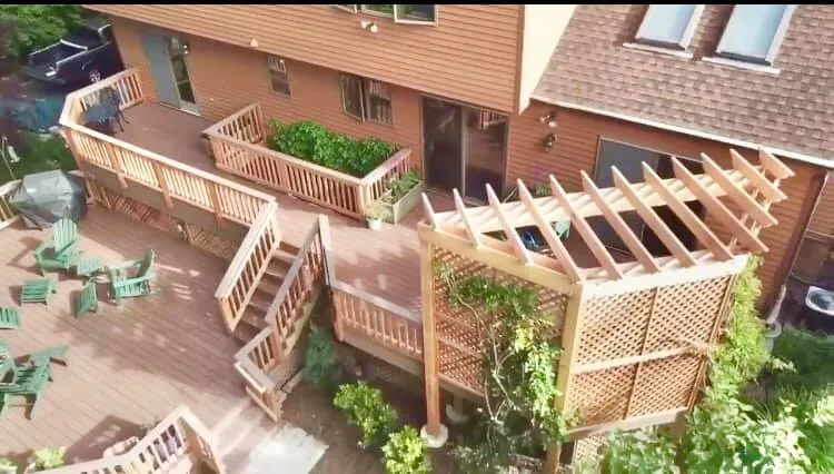 Multi-level deck and outdoor living space seen from above at a Hudson Valley home
